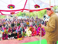 Education Minister addressing a gathering after inaugurating a bridge at Sidhpur