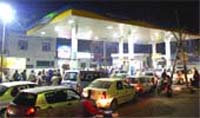 The owners line up their vehicles at a petrol station in view of a shortage of petrol and diesel in Jalandhar