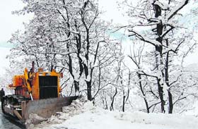 A snowcutter clears the Jammu-Srinagar highway near Srinagar