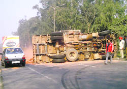The truck that overturned on the highway near Sahnewal on Thursday.