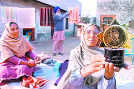Balwinder Kaur (R), sarpanch of village Naina Khurd at her residence in Patiala district on Thursday. 