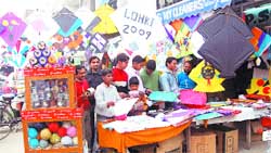 Children buy kites and dor (thread) before Lohri in Amritsar