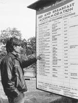 A person looks at a “Bed and breakfast” scheme board at Sukhna Lake on Friday.