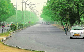 Madhya Marg wears a deserted look as vehicles went off road owing to a strike by employees of oil companies in Chandigarh on Friday.