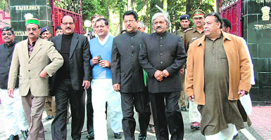 Uttarakhand Pradesh Congress chief Yashpal Arya (in blue sweater) and other leaders come out of the Raj Bhawan after submitting a memorandum to the Governor in Dehradun on Saturday.
