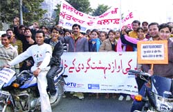 Students and staff of Lally Infosys take out a rally against terrorism 