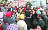 Small-scale unit and tiny industry owners protest at Bhagwan Chowk regarding power cuts imposed by the PSEB