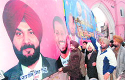 BJP MP Navjot Singh Sidhu removes hoardings with his pictures in Amritsar