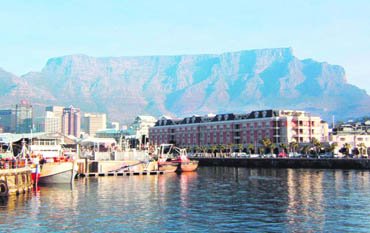 Cape Town is surrounded by the picture-postcard scenery of the Table Mountain, wine lands, 