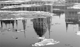 Parliament building is reflected on the frozen river Danube in Budapest on Saturday.