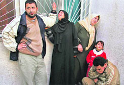 Palestinians react at Kamal Odwan hospital after their relatives were killed by an Israeli tank shell in the northern Gaza Strip.