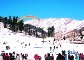 The Pir Panjal ranges provide a perfect backdrop as tourists enjoy paragliding in the Solang valley, 13 km from Manali