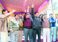 A Class III employee protests at the office of Surveyor-General.