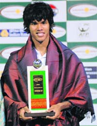 Somdev Devvarman of India holds his trophy after being defeated by Marin Cilic of Croatia in the finals of the Chennai Open ATP tennis tournament