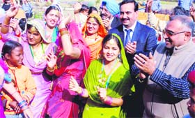 MP Avinash Khanna and Gurvinder Bahra, vice-chairman, Rayat and Bahra College, celebrate Lohri on the campus near Mohali