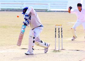 A batsman defends a rising delivery in a match between Central School and Bal Mandir in Haridwar