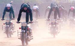 Police daredevils practise their stunts in Jammu on Tuesday for the Republic Day parade.