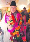Profusely garlanded Farooq after he took over as the NC president in Srinagar