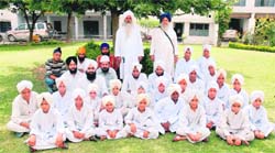 The incumbent of Dera Nangali Sahib, Mahant Manjeet Singh, along with the underprivileged children on the Ashram campus in Jammu.