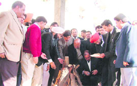 Dignitaries light a Lohri fire at District Courts Complex in Ludhiana on Tuesday.