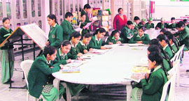 Students at a classroom library in Greenland Senior Secondary School.