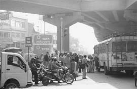 With no place to park buses, a roadways bus picks passengers in a tow-away zone, marked by the Mohali police, at Zirakpur.