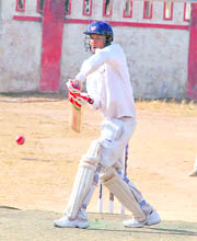 A batsman plays a defensive shot at the 57th District Cricket League at Survey Stadium, Dehradun on Wednesday.