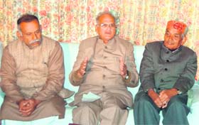 K.C. Sharma (centre), chairman of the state high-powered committee for reforms on temples, addressing a press conference at Dharamsala