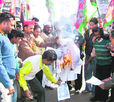 Activists of the Samajwadi Party stage a protest in Ludhiana on Wednesday.