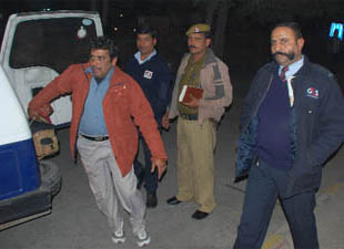 The photographer of State Times (left) who was assaulted by Group-4 security guards at Connaught Place police station in New Delhi on Thursday.