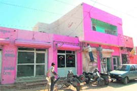 Painters give a new look to shops in Fatehabad.