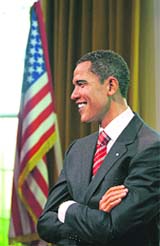 A wax replica of US President-elect Barack Obama is unveiled in a mock-up of the White House's Oval Office, at Madame Tussauds in London on Thursday.