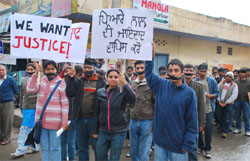 Activists of Art of Living from Chandigarh staging protest outside the district court in Muktsar