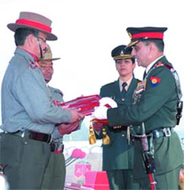 Col. Deepak Sharma, Commandant 32 Assam Rifles and Sub Maj. B.B. Gurung receive the Chief of Army Staff Unit citation from Gen. Deepak Kapoor on Army Day in New Delhi on Thursday.