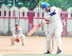 Doon Riders batsman plays a shot at the 57th District Cricket League underway at Survey Stadium, Dehradun.