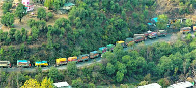 A long queue of loaded trucks stranded on the Ramban-Banihal highway following a downpour on Friday.