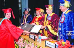 Chairman of the UGC S.Thorat presents a degree to a student at the convocation of the NDRI in Karnal