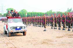 Chief Minister Bhupinder Singh Hooda inspects a guard of honour at a passing-out parade of Haryana Police constables in Hisar