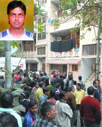 People gather outside the New Rajender Nagar house of Uma, who was shot at by her friend Sanjay (inset)