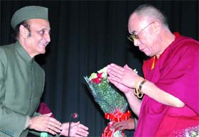 Tibetan spiritual leader the Dalai Lama being welcomed by Karan Singh, president of the Indian Council of Cultural Relations, at the India Islamic Cultural Centre in New Delhi