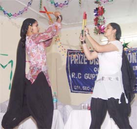 School girls perform dandia in a prize distribution ceremony at Sector-4 Community Centre in Gurgaon