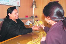 Niru Bhatia, a tarot card reader and astrologer, with a client in Dehradun