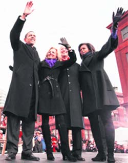 (From left): US President-elect Barack Obama, Jill Biden, wife of Vice-President-elect Joe Biden, Biden, and Michelle Obama, wife of the President-elect, wave at a rally during a stop on their inaugural Whistle Stop train trip in Wilmington, Del., on Saturday.  AP/PTI