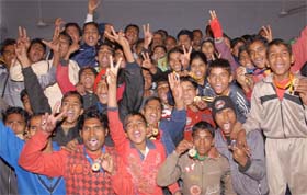 The jubilant Bathinda Sports Stadium team members, who picked up the overall winners trophy at the District Amateur Boxing Championship, pose in Bathinda