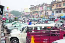 Vehicles parked haphazardly on the Chakrata Road in Dehradun.