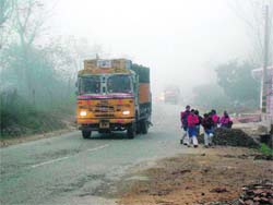 Fog is no deterrent to schoolchildren at Nulakha village near Sundernagar