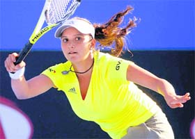 Sania Mirza returns to Polands Marta Domachowska during singles match