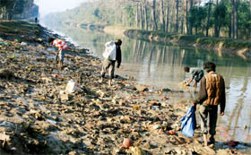 Rag pickers carrying plastic bags and waste from the Bathinda canal on Tuesday that is the main drinking water source of the town.