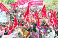 CITU cadres stage a protest rally in Dehradun.
