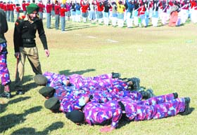 Group leader punishes NCC cadets during Republic Day rehearsal at Jalandhar.